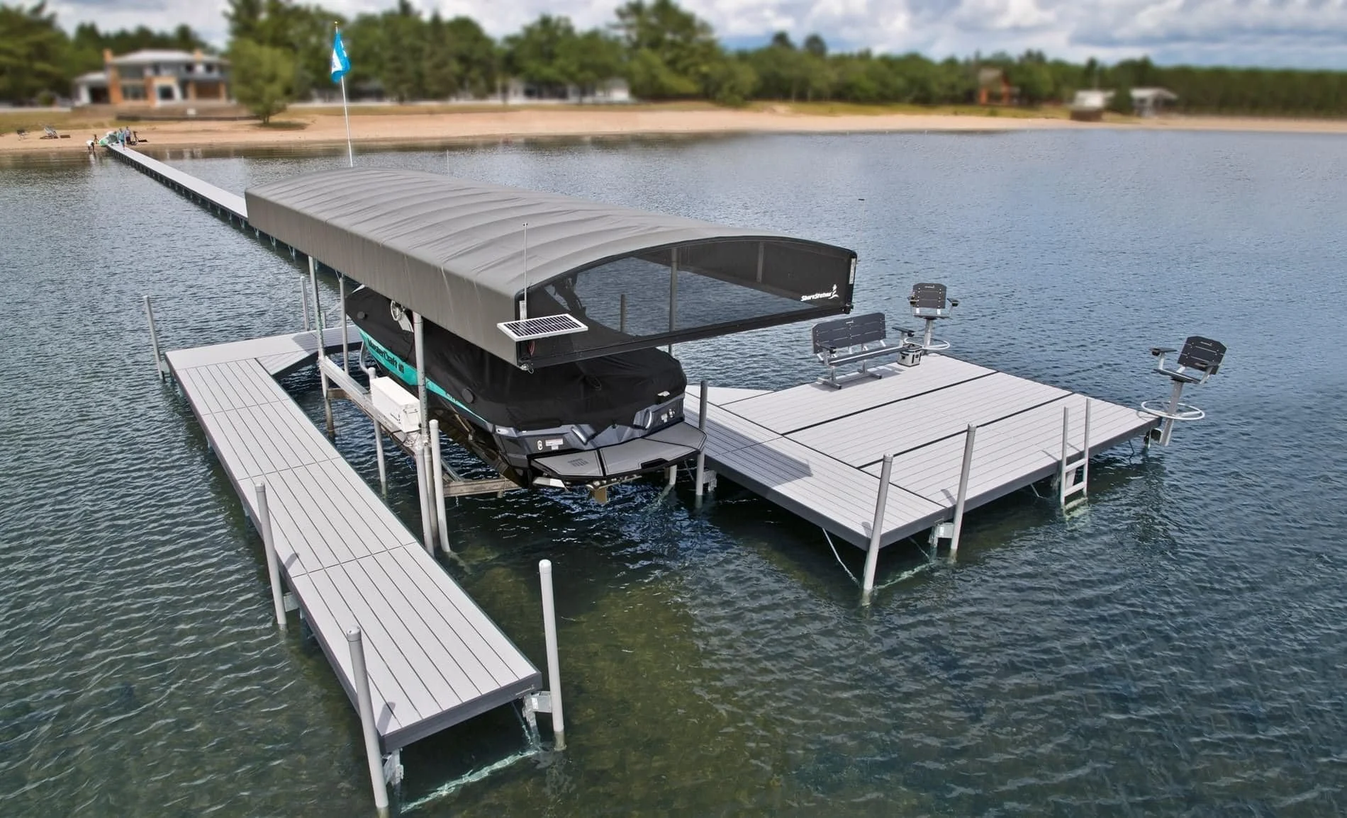 ShoreStation dock and hydraulic boat lift fitted with a Revolution canopy