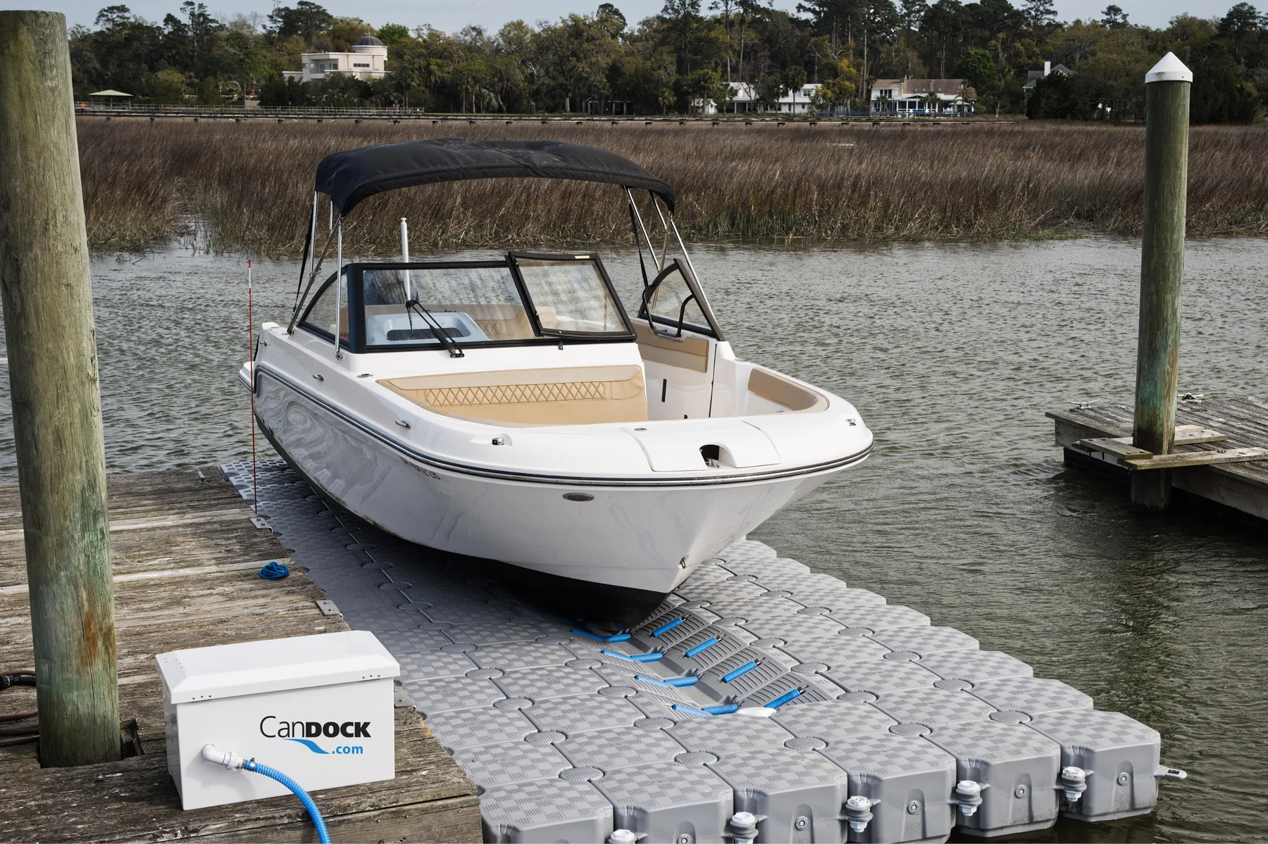 Boat resting on a V-Roll drive-on section built into a modular CanDock platform