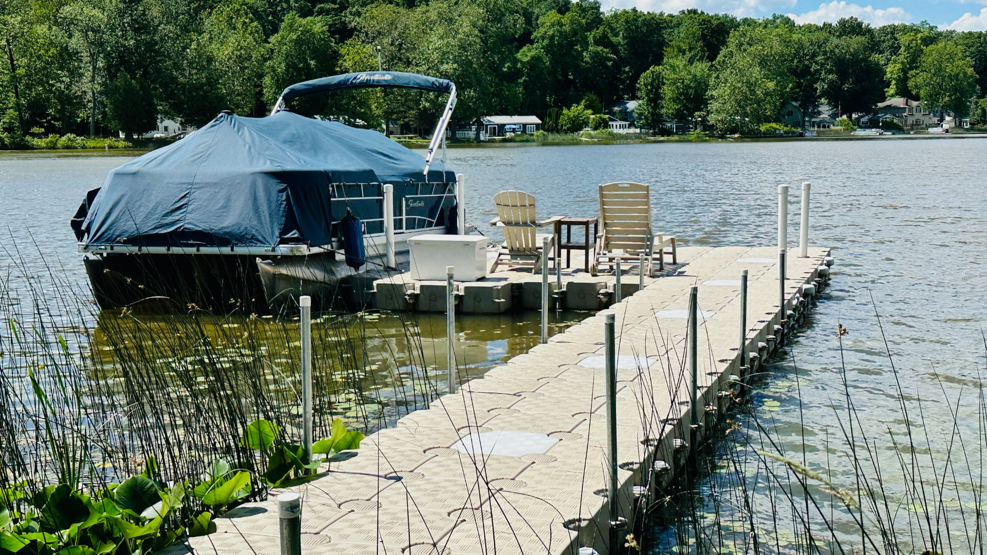 CanDock modular floating dock with seating area and a pontoon boat
