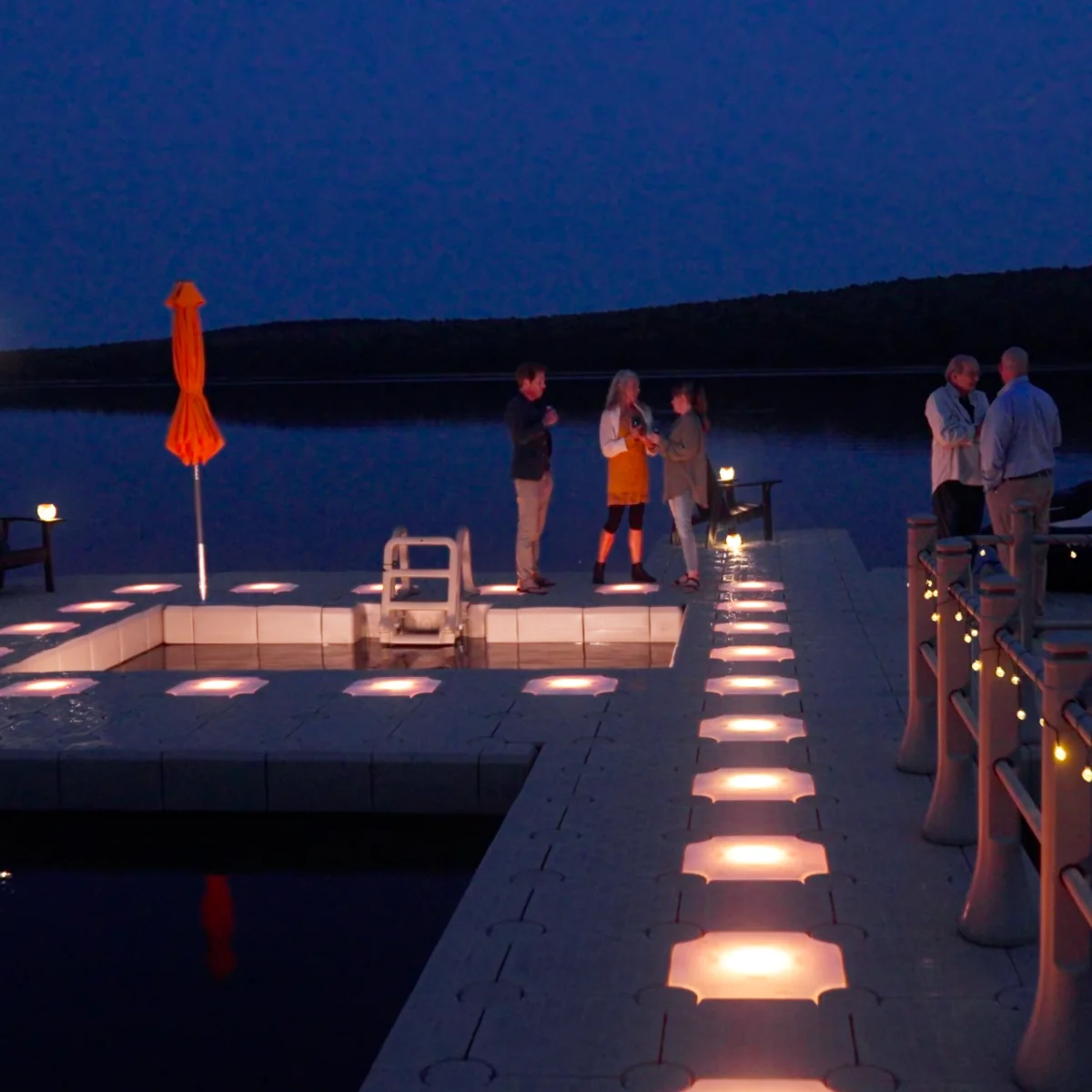 CanDock floating dock illuminated with integrated dock lighting at night
