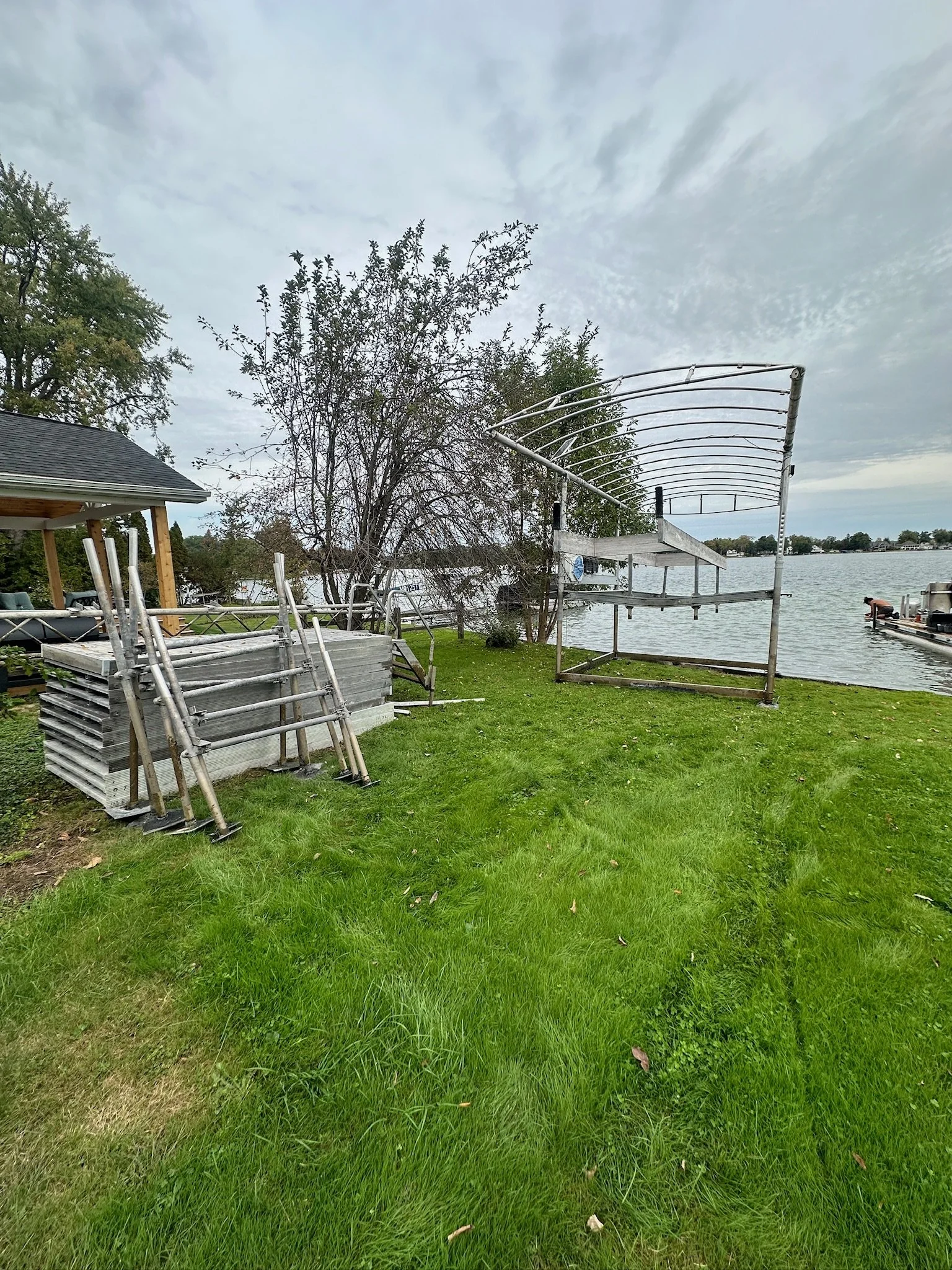 Boat lift and dock sections on a Southwest Michigan shoreline in late season