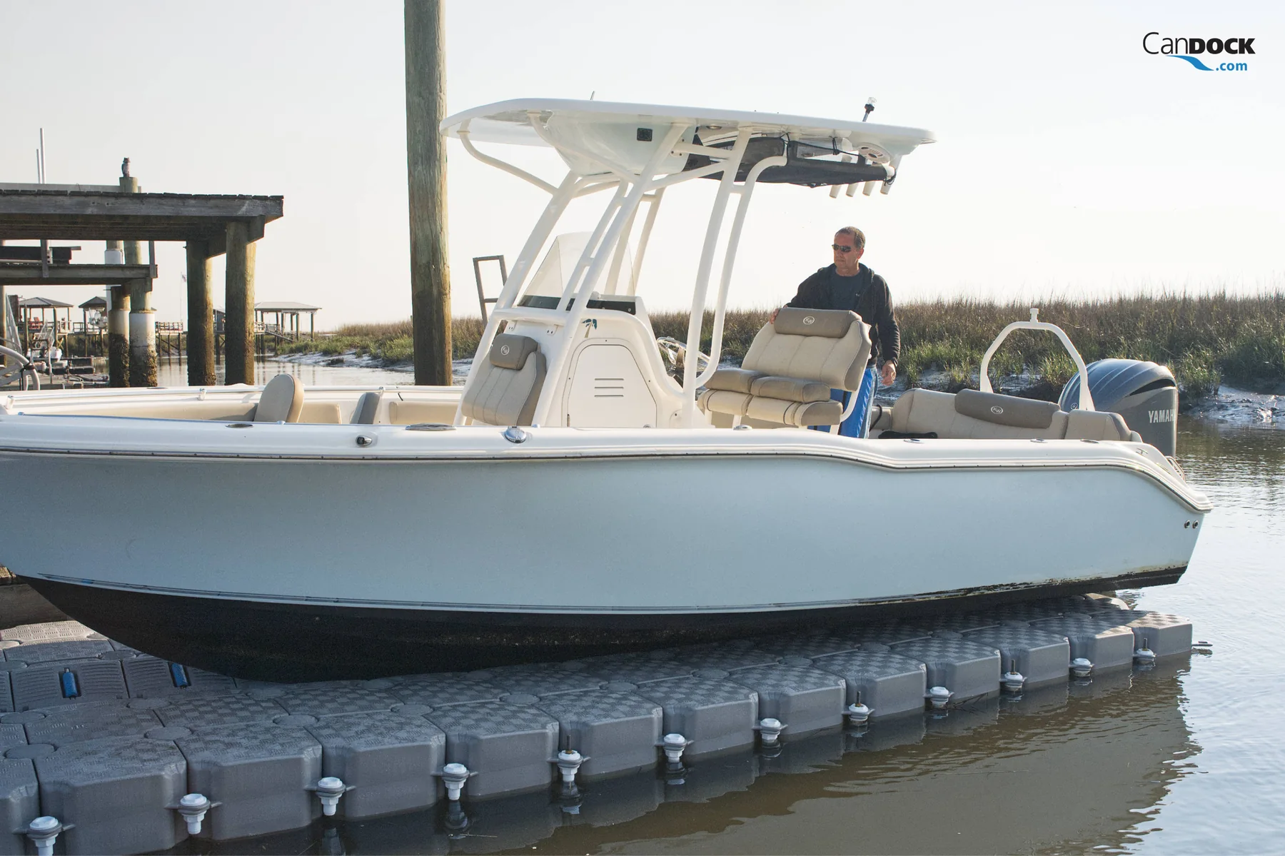 Compatible V-hull boat resting on a CanDock V-Roll drive-on system